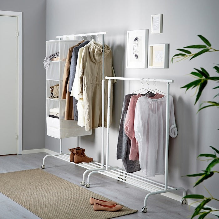 Adjustable white IKEA RIGGA clothes rack for bedroom and laundry