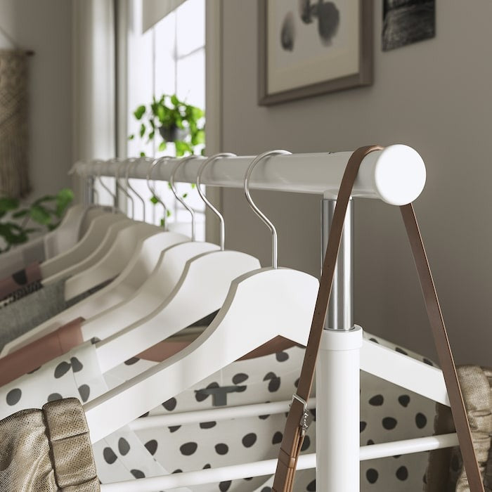 IKEA RIGGA white metal clothing rack with shoe storage shelf.