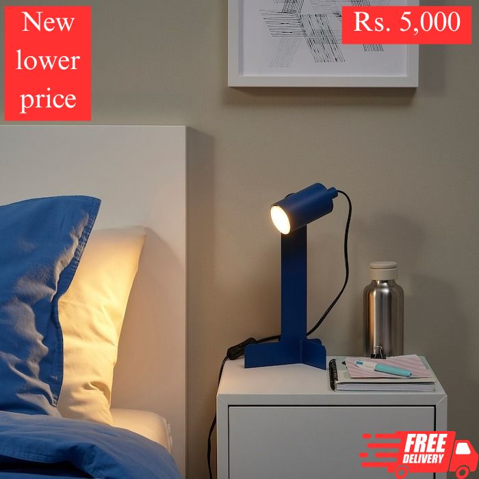 IKEA desk lamp FLOTTILJ in dark blue color.