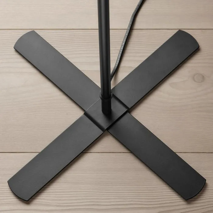 Black base of IKEA BARLAST floor lamp.