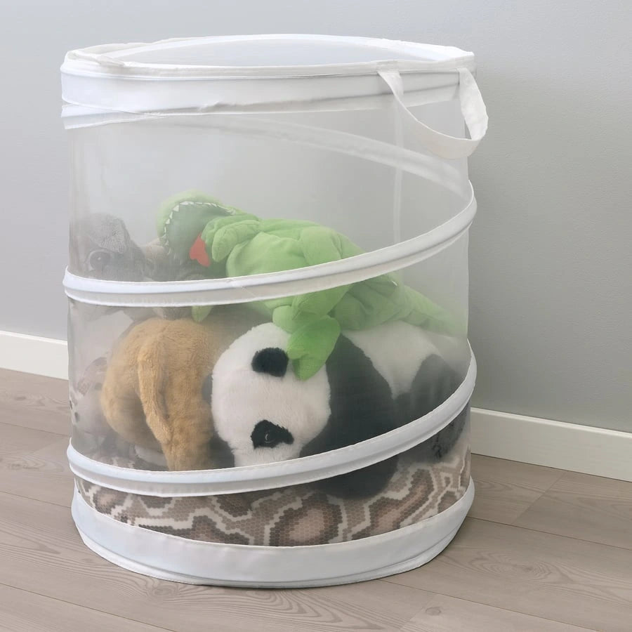 IKEA FYLLEN white laundry basket placed in a bedroom