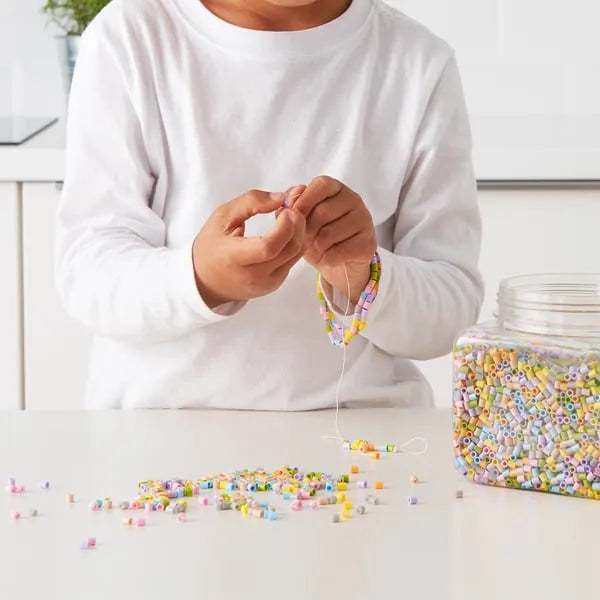 Assorted pastel IKEA PYSSLA beads for kids art projects.