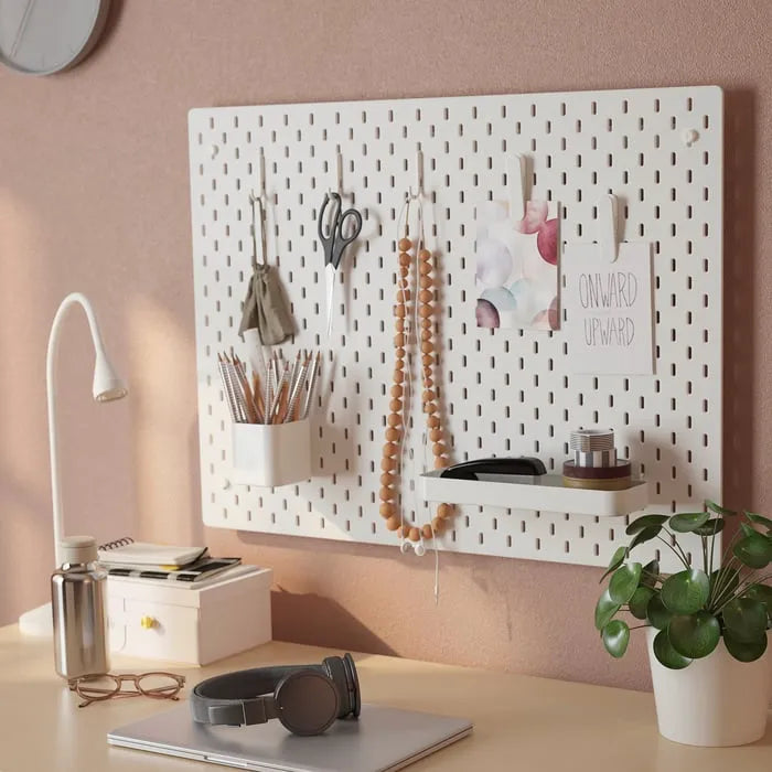 White IKEA SKÅDIS pegboard accessory kit for home organization.
