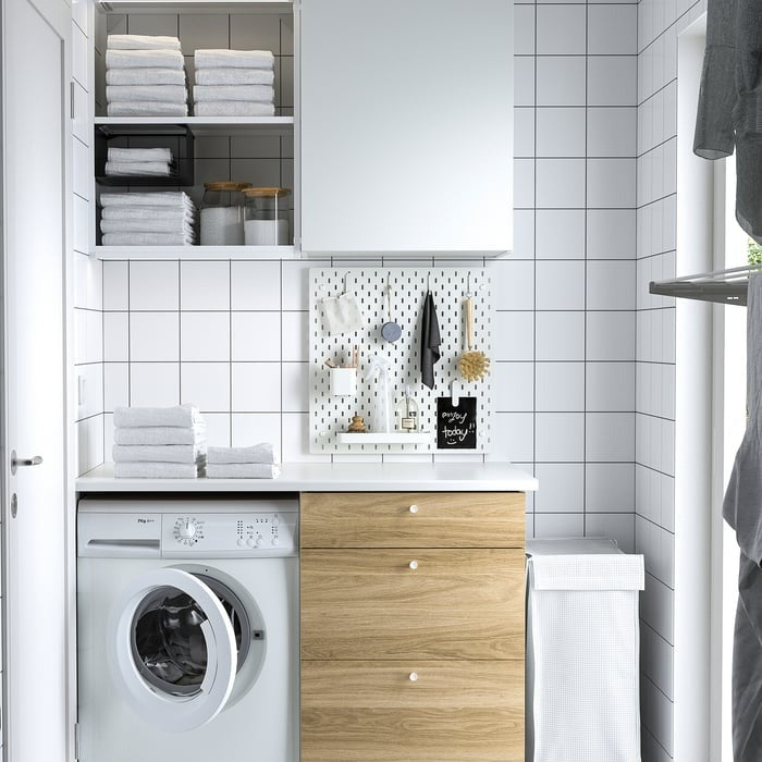 IKEA SKÅDIS white storage accessories hooks and containers set.
