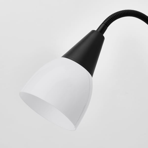 IKEA dual floor lamp with adjustable reading arm black and white.