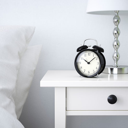 IKEA DEKAD Alarm clock in black color.