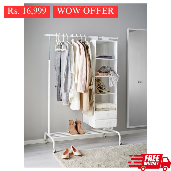 IKEA RIGGA clothes rack in white color with castors.