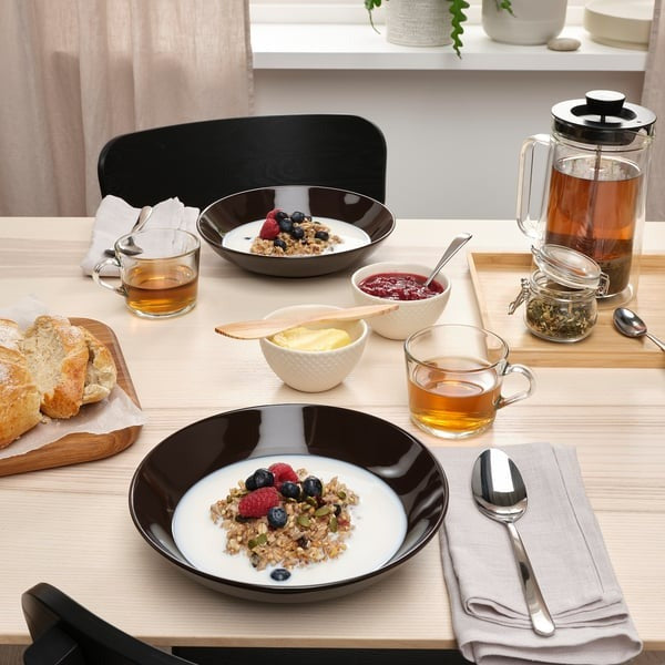 IKEA deep plate in glossy brown colour having size 23 cm.
