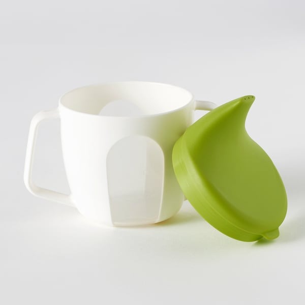 IKEA training beaker BORJA in green and white color.
