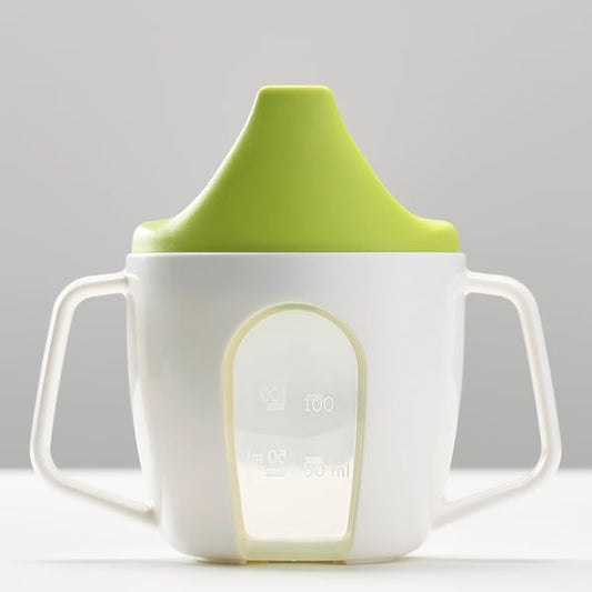 IKEA training beaker BORJA in green and white color.