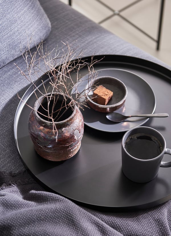 IKEA GLADOM tray table in black color.