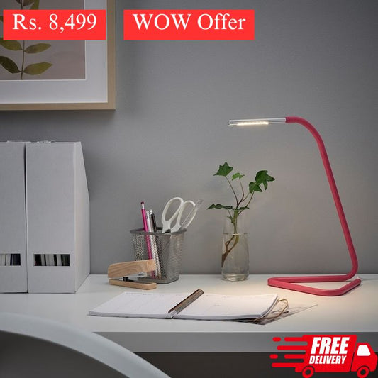 IKEA HARTE LED work lamp in bright pink and silver color.