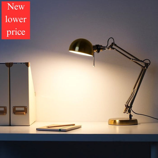 IKEA FORSA work lamp in gold color.