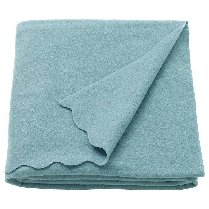 IKEA THROGUN throw for sofa in light blue color.