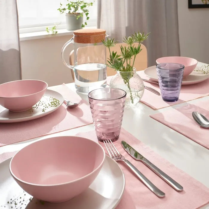 Colourful IKEA GLASMAL drinking glasses on table