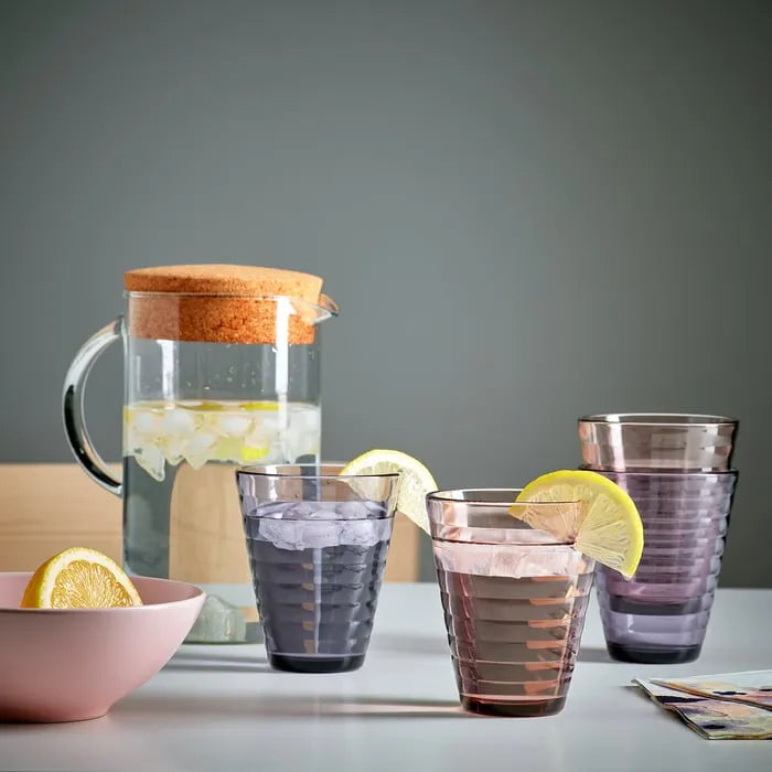 Colourful IKEA GLASMAL drinking glasses on table
