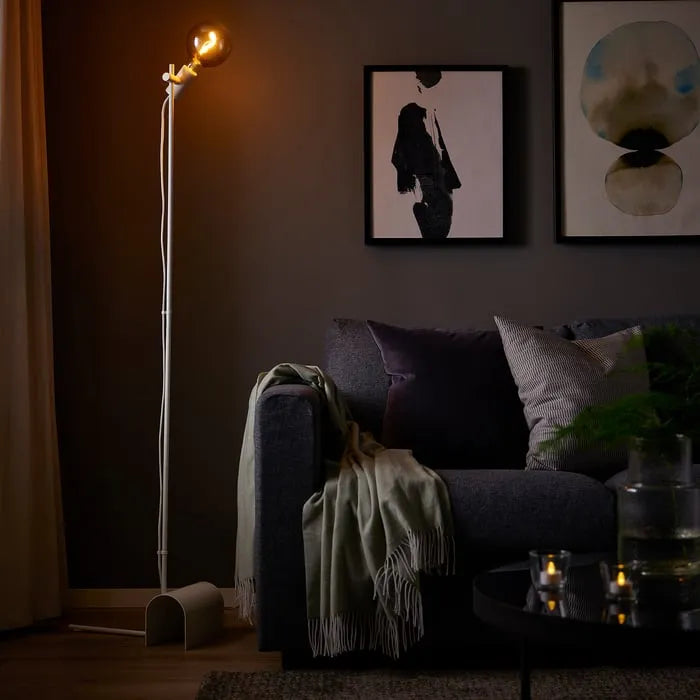 IKEA HÅRSLINGA floor lamp placed in living room corner