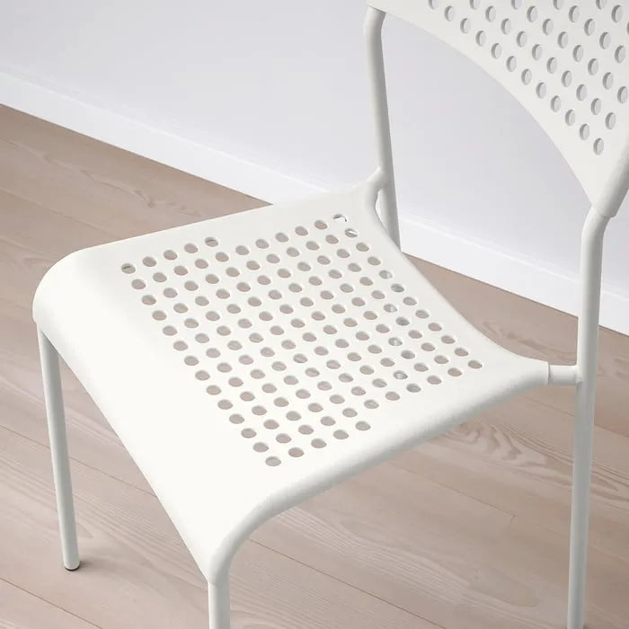 Closeup of IKEA ADDE lightweight chair.