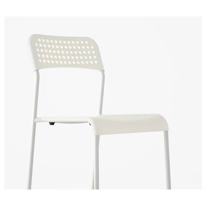 Side view of IKEA ADDE Chair in white.