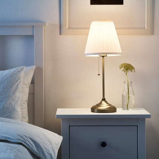 IKEA ÅRSTID table lamp brass and white for bedroom or living room.