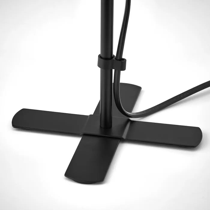 Close-up view of IKEA BARLAST bedside lamp.