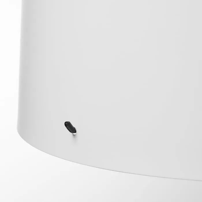 Close-up view of IKEA BARLAST bedside lamp.