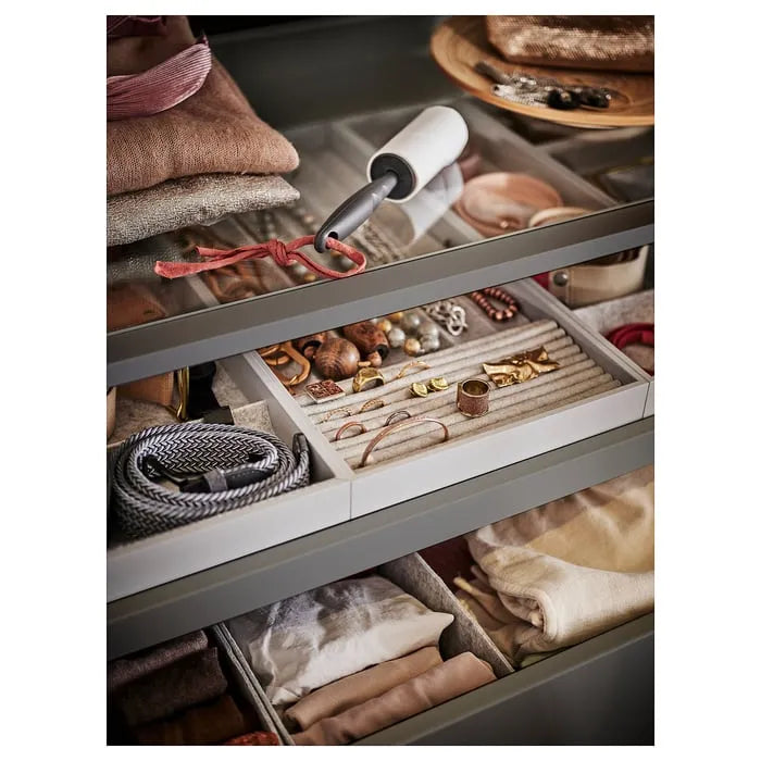 Close-up of IKEA BÄSTIS lint roller handle and adhesive roll