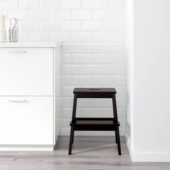IKEA BEKVAM black step stool used in kitchen.
