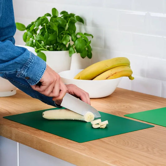 IKEA FINFORDELA chopping board used for cutting vegetables.