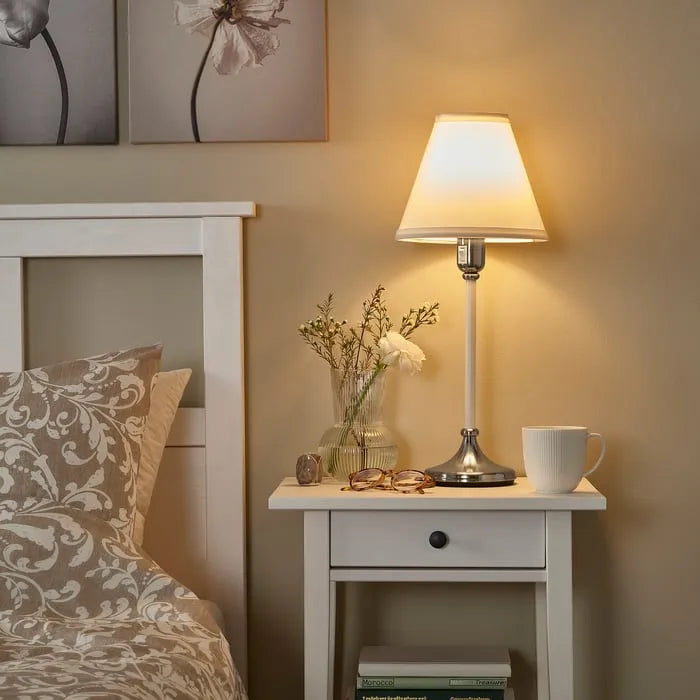 Modern bedside lamp IKEA FLYGHOJD on night table