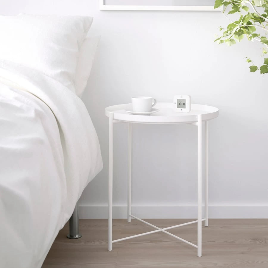 IKEA GLADOM tray table styled beside a bed