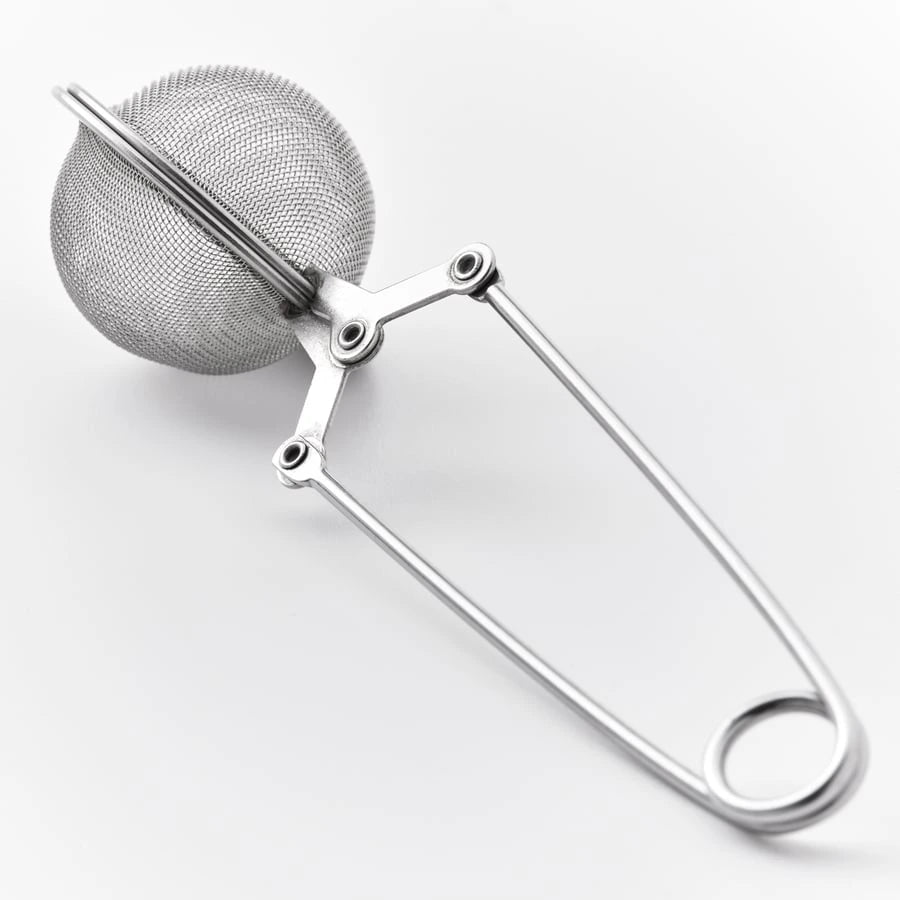 Close-up of IKEA IDEALISK stainless steel tea infuser