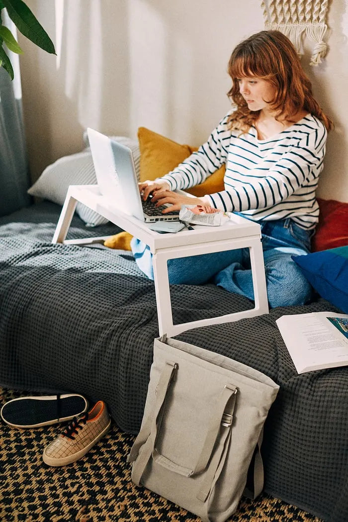 IKEA KLIPSK bed tray used as laptop table.