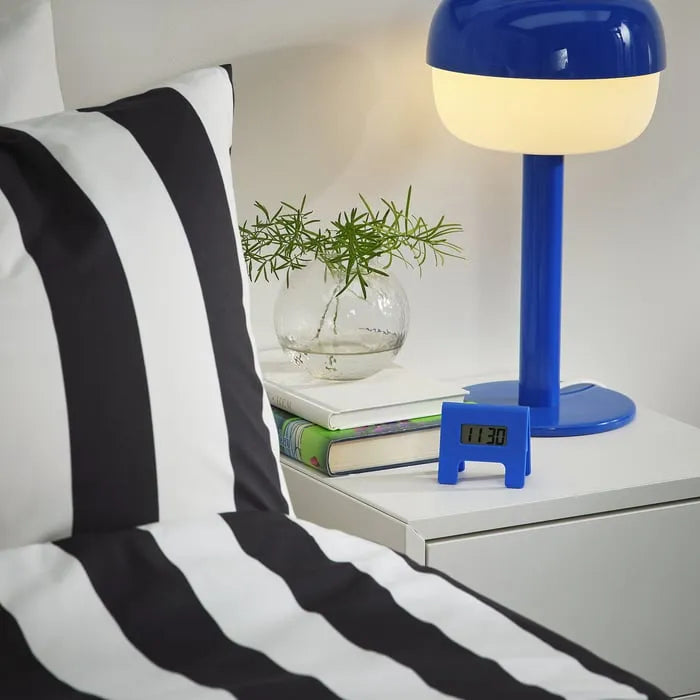 IKEA KUPONG alarm clock placed on bedside table