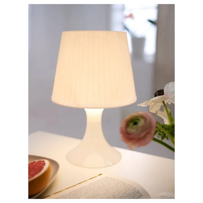 IKEA LAMPAN lamp placed in corner for cosy mood lighting