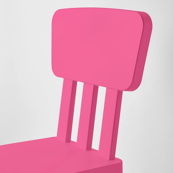 Close up of durable lightweight IKEA MAMMUT kids chair pink.