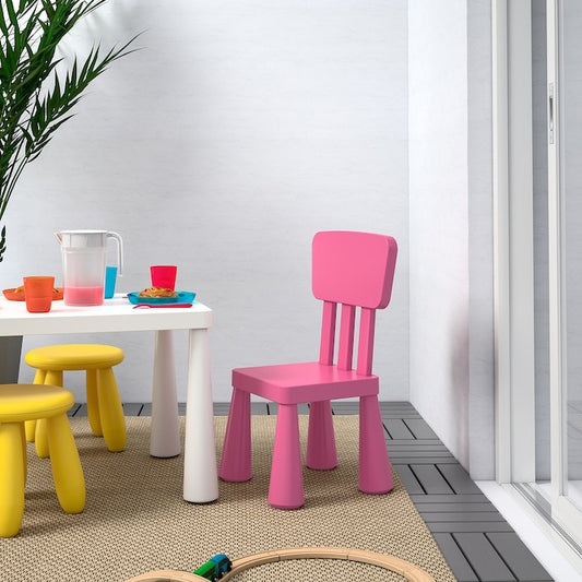 IKEA MAMMUT pink children’s chair for indoor and outdoor use.