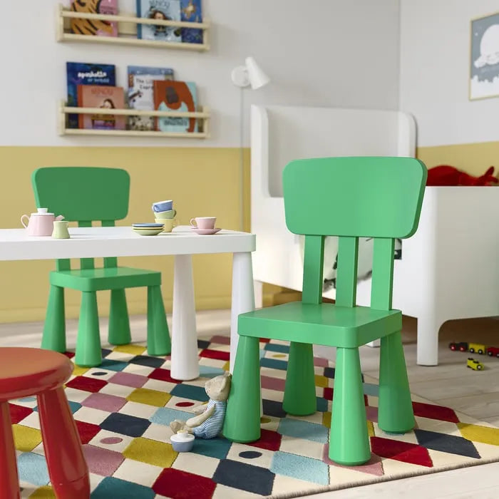 Bright green plastic children’s chair by IKEA Pakistan.