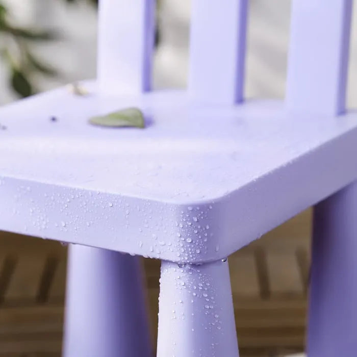 Closeup of IKEA MAMMUT kids chair lilac colour for indoor outdoor use.