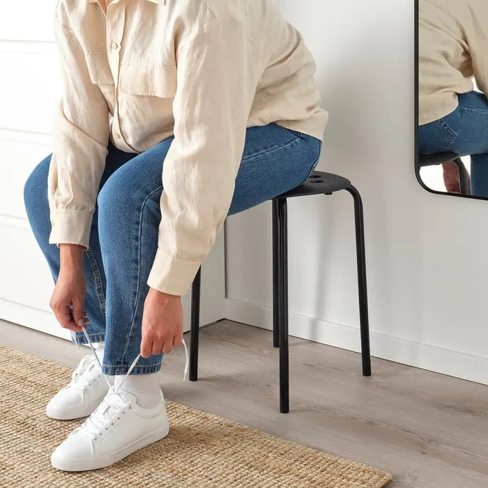 Side view of IKEA MARIUS black stool.