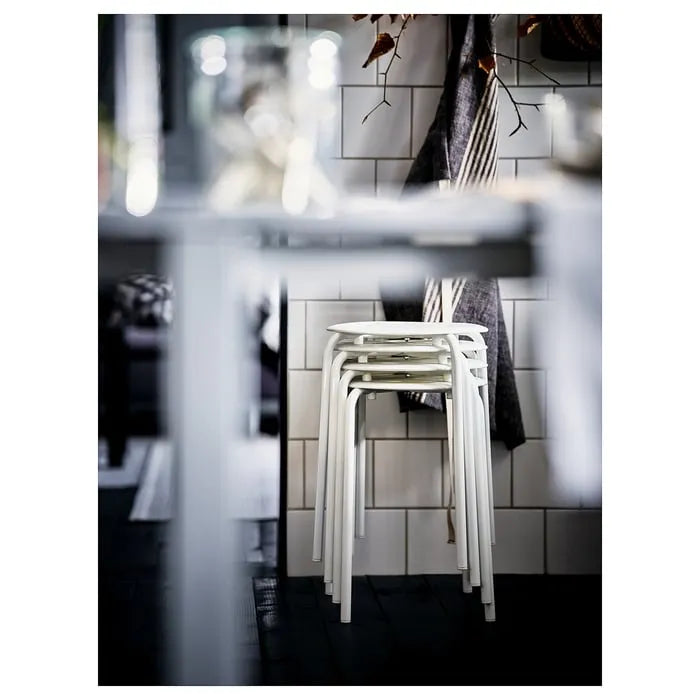 Stackable IKEA MARIUS stools in white.