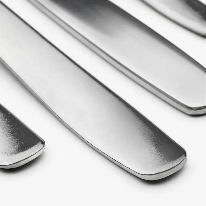 Stainless steel IKEA MOPSIG cutlery set close-up.