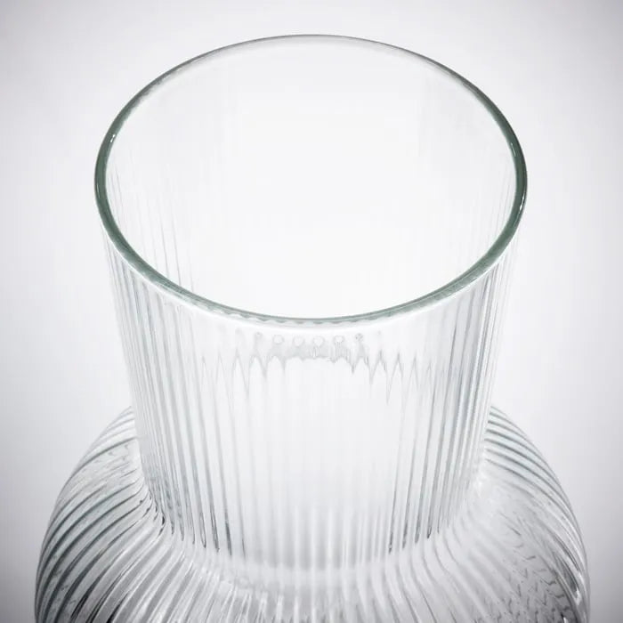 Close-up of IKEA PADRAG elegant clear glass vase.
