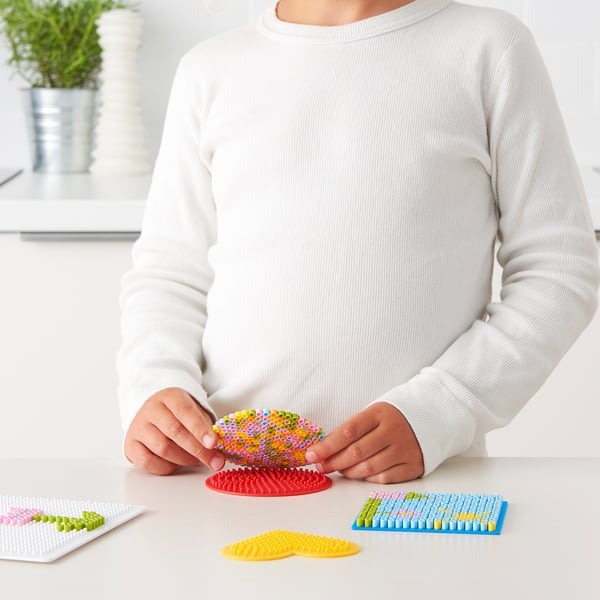 Reusable bead pegboards IKEA PYSSLA set for craft fun.