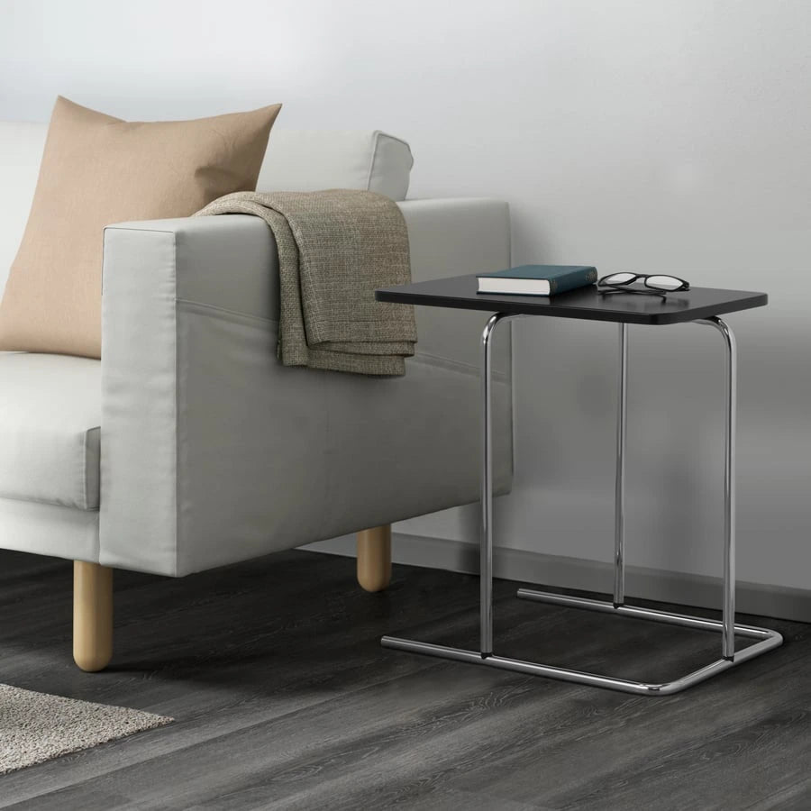 IKEA RIAN side table positioned beside a sofa