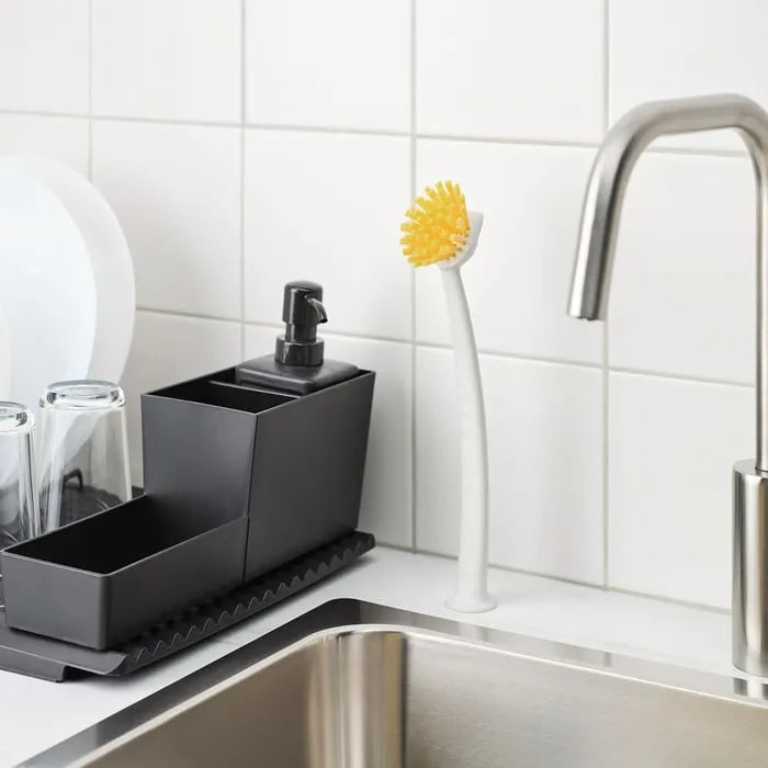 IKEA RINNIG dishwashing brush used in kitchen sink.