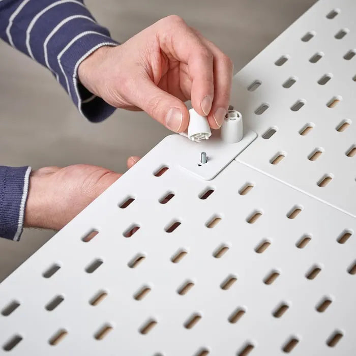 IKEA SKÅDIS connector joins pegboards together white color.