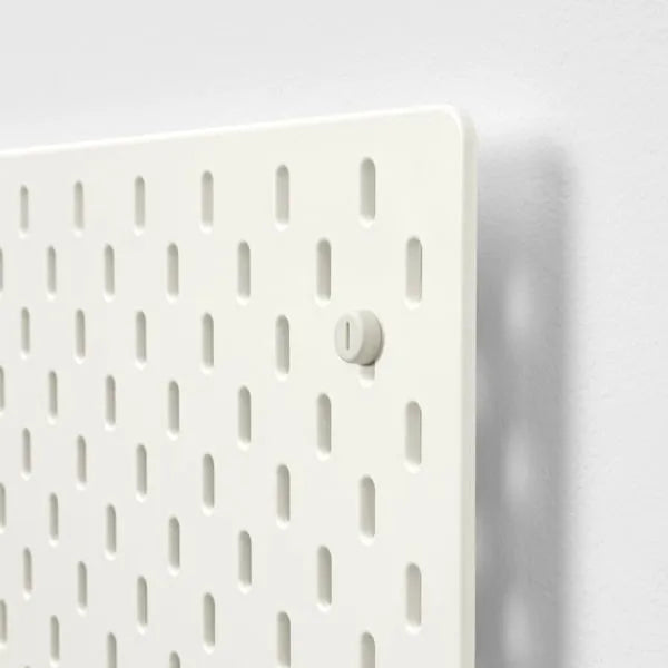 IKEA SKÅDIS white pegboard for office or kitchen storage.