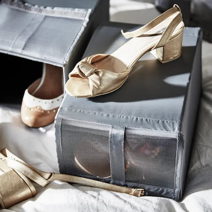 Stackable IKEA SKUBB dark grey foldable shoe organizer boxes.