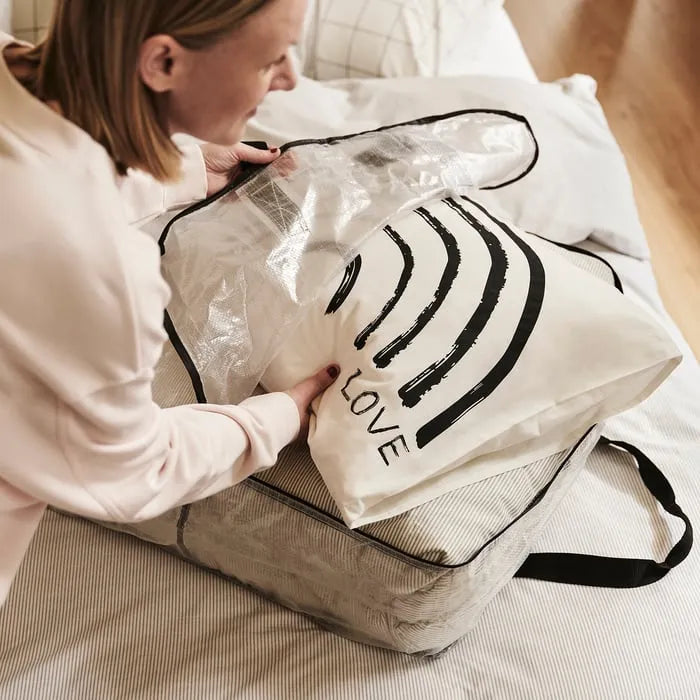 Clothes neatly stored inside IKEA DIMPA storage bag